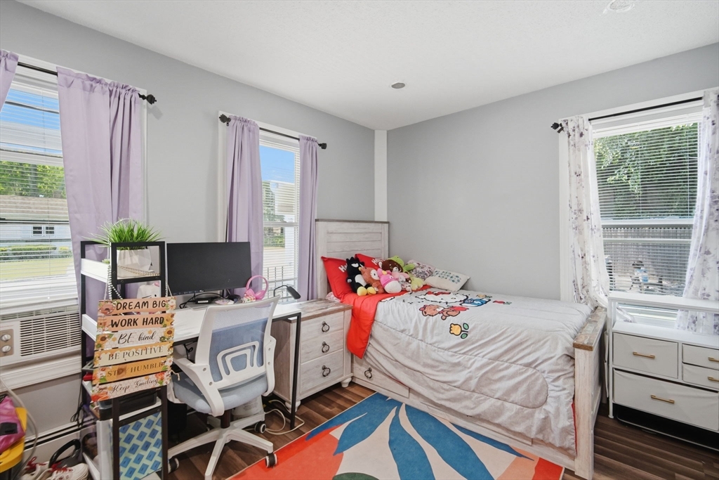 72 Switzer Avenue Springfield, MA 01109 - Photo 17 of 37 a bedroom with a bed and a desk