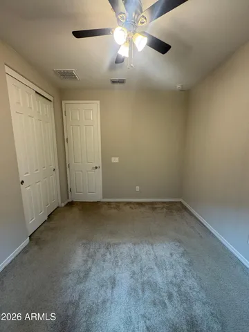 a bathroom with a sink a toilet a mirror and shower