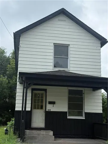 a front view of a house with garage