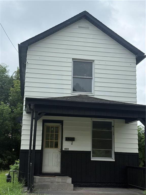 a front view of a house with garage