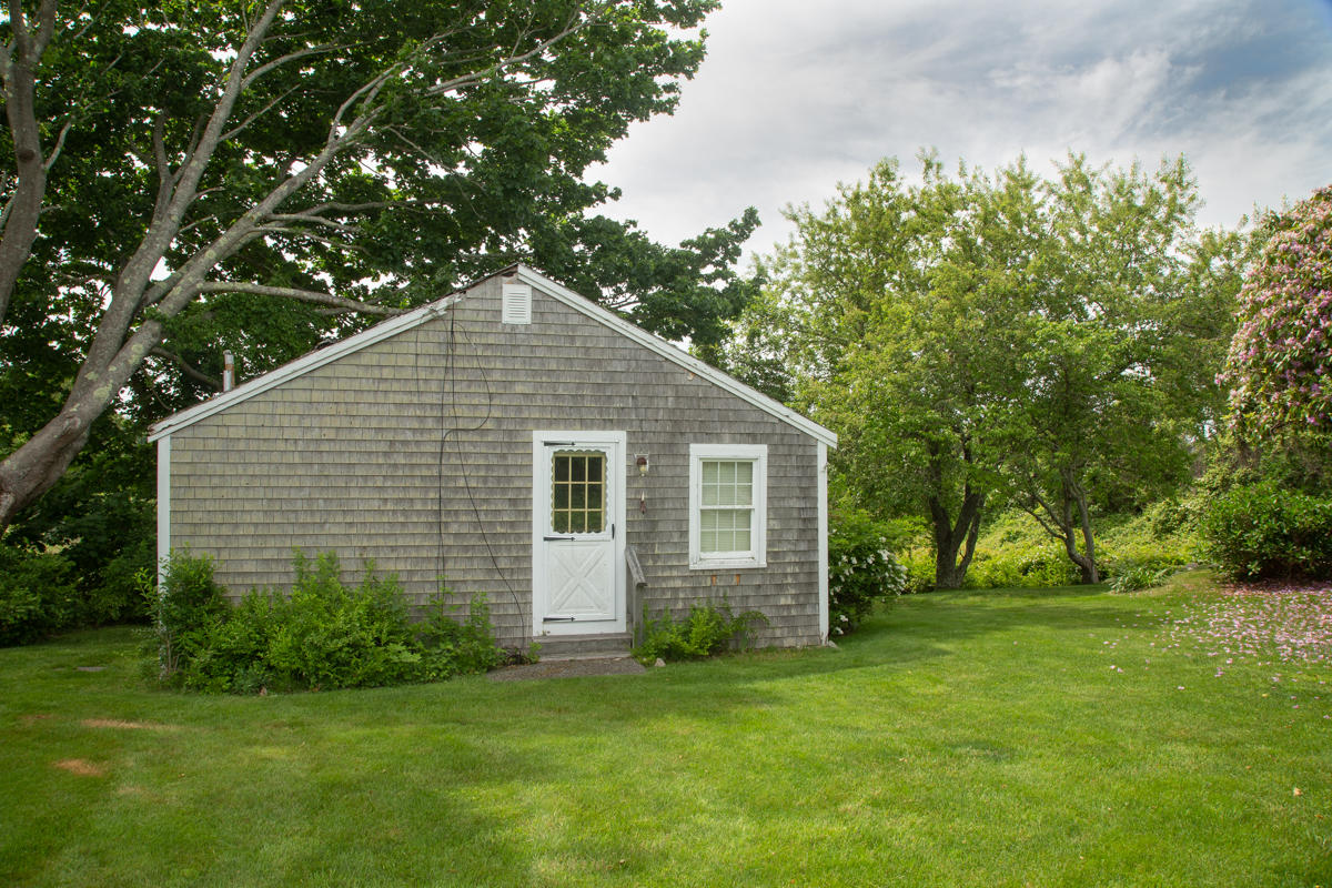 205 Stoney Point Road Cummaquid, MA 02675 - Photo 14 of 24 a front view of house with yard and green space