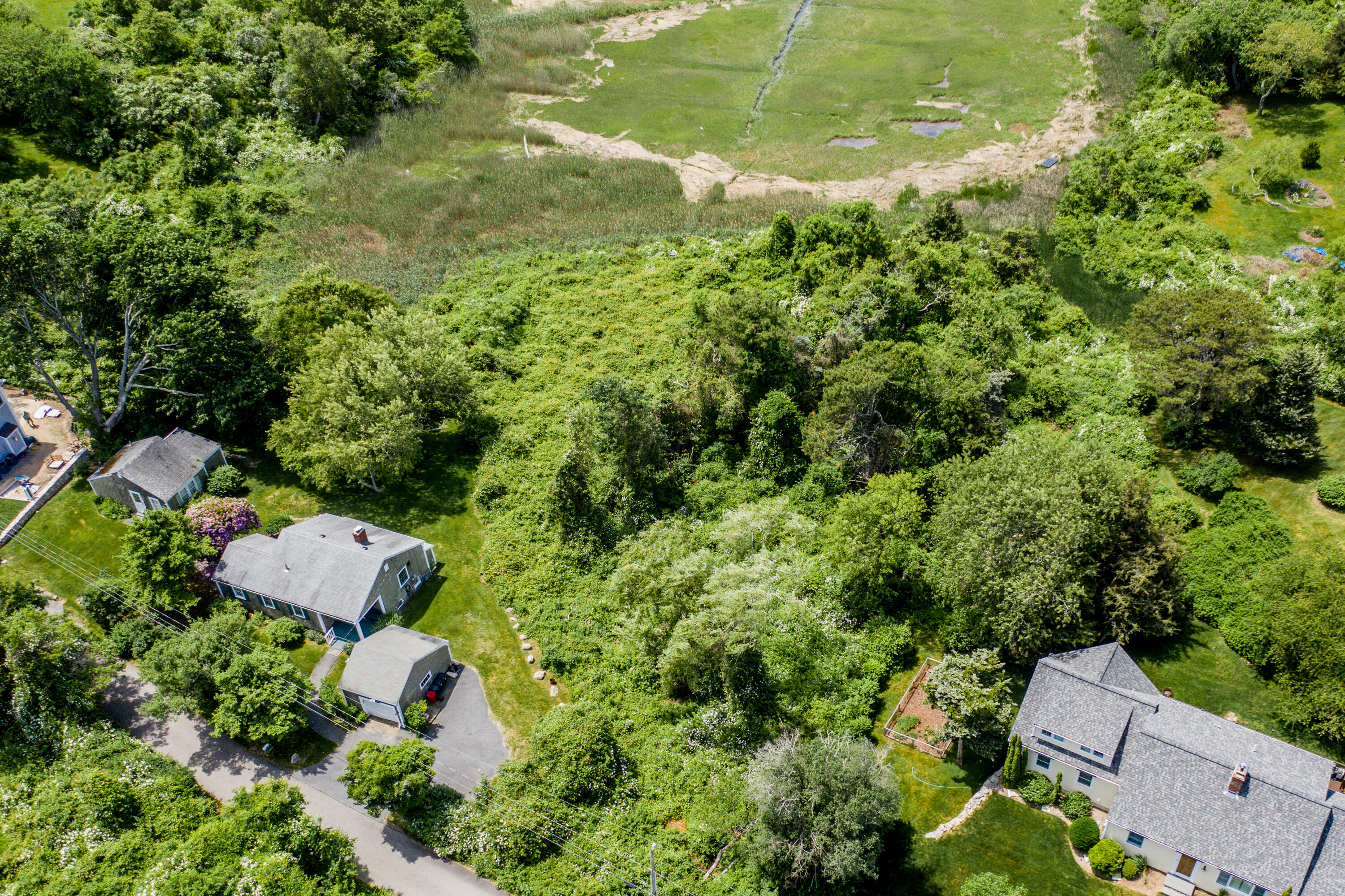205 Stoney Point Road Cummaquid, MA 02675 - Photo 22 of 24 an aerial view of residential house with pool and outdoor space