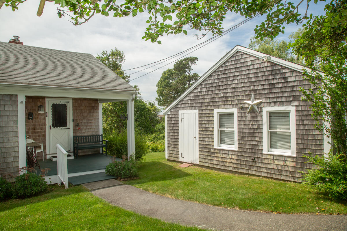 205 Stoney Point Road Cummaquid, MA 02675 - Photo 8 of 24 a view of a house with a yard