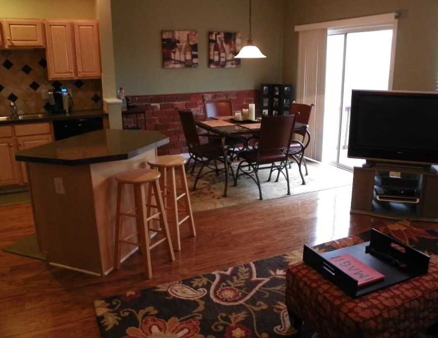 1345 Bell Road, Unit 312 Antioch, TN 37013 - Photo 2 of 7 a view of a dining room with furniture and a flat screen tv