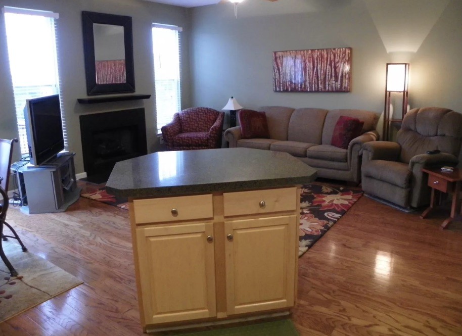 1345 Bell Road, Unit 312 Antioch, TN 37013 - Photo 4 of 7 a living room with furniture and a flat screen tv
