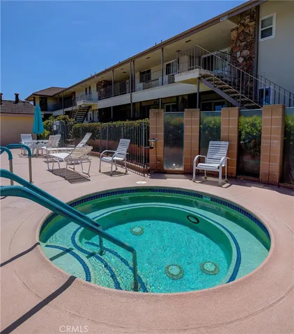 a view of a swimming pool with a patio