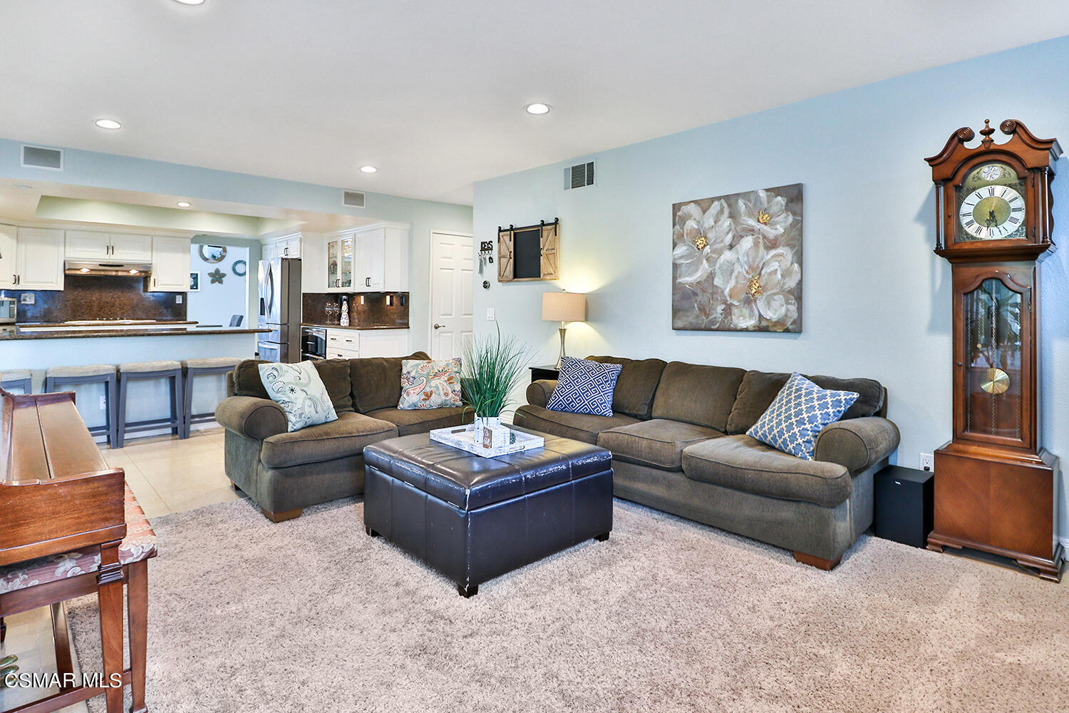 3053 Bianca Circle Simi Valley, CA 93063 - Photo 15 of 73 a living room with furniture a rug kitchen view and a table