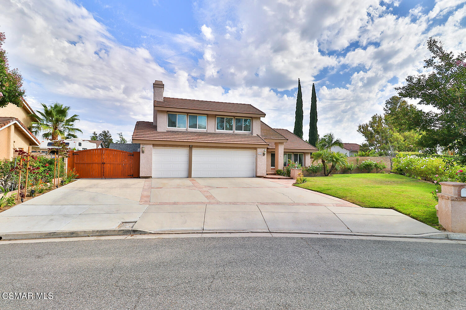 3053 Bianca Circle Simi Valley, CA 93063 - Photo 2 of 73 a front view of a house with a yard and garage