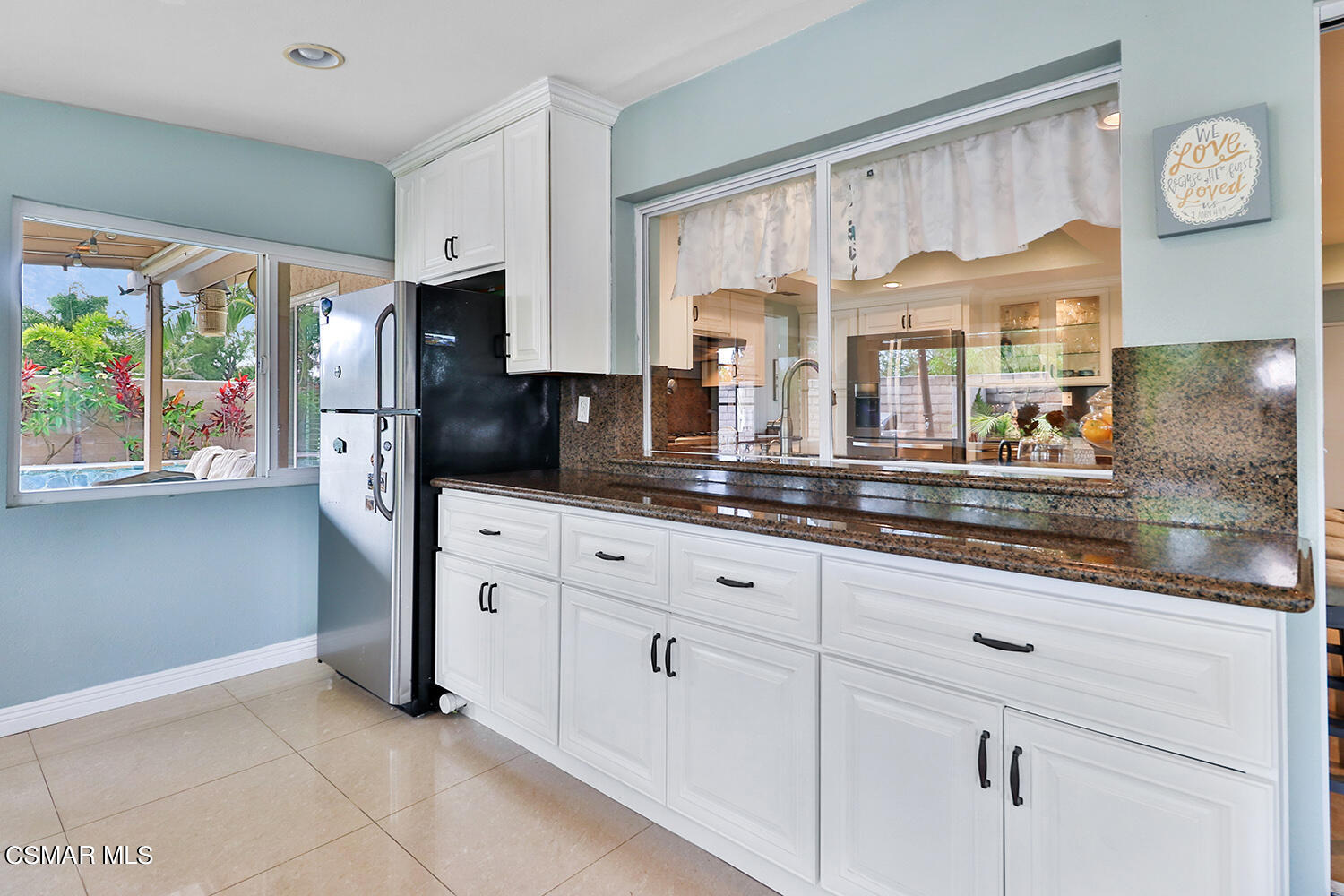 3053 Bianca Circle Simi Valley, CA 93063 - Photo 27 of 73 a kitchen with stainless steel appliances granite countertop a refrigerator and a sink
