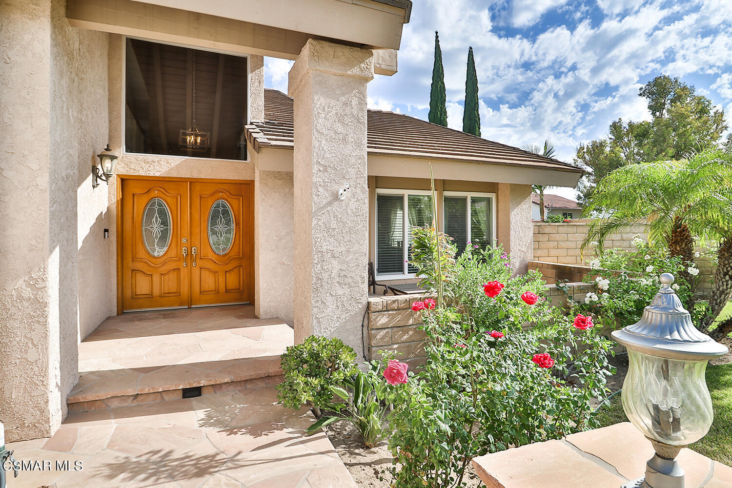 3053 Bianca Circle Simi Valley, CA 93063 - Photo 6 of 73 a view of a potted flower in front of a house