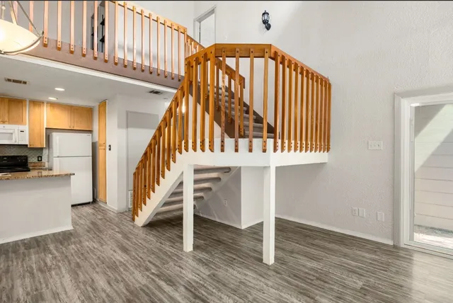a view of entryway with wooden floor