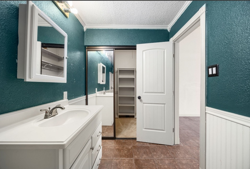 1748 Ohlen Road, Unit 42 Austin, TX 78757 - Photo 17 of 17 a bathroom with a sink and a mirror