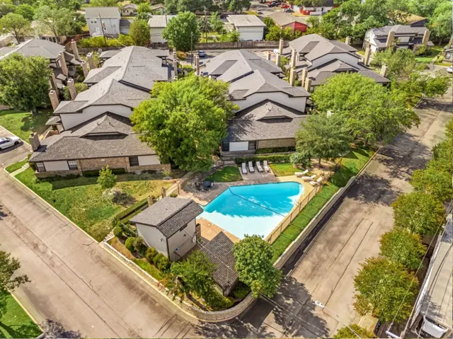 an aerial view of a house with a garden