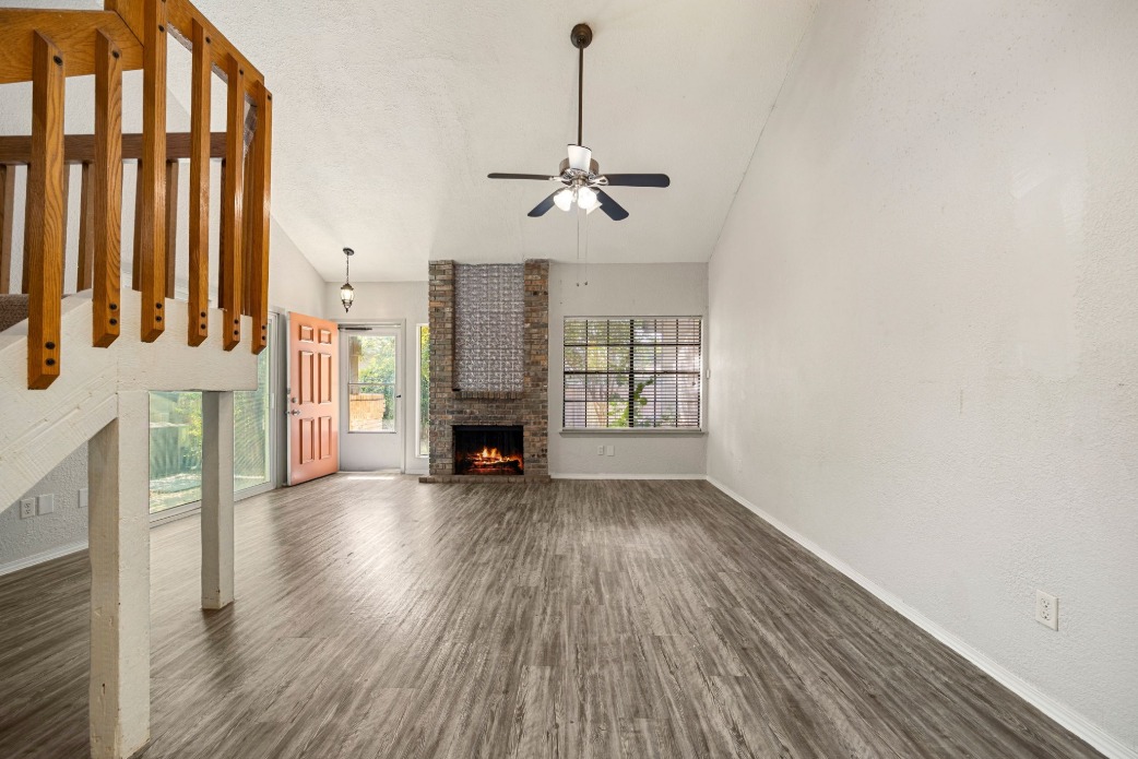 1748 Ohlen Road, Unit 42 Austin, TX 78757 - Photo 10 of 17 wooden floor in an empty room with a window