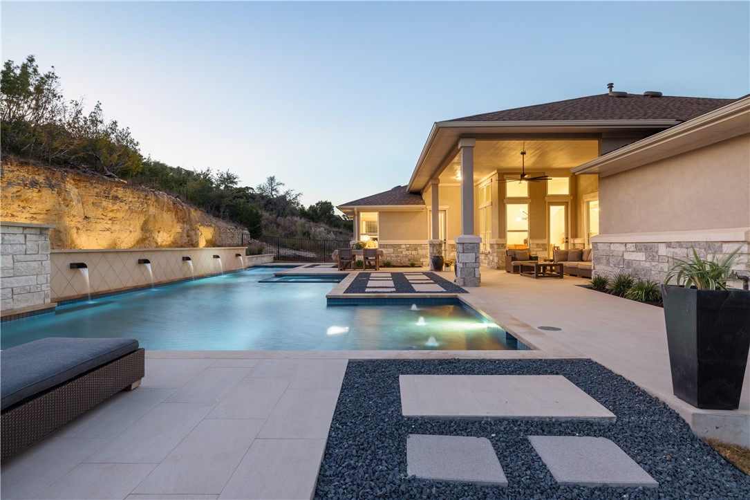 a view of swimming pool with outdoor seating