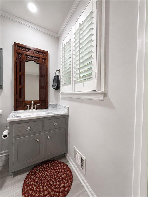 225 Pineridge Road Bogart, GA 30622 - Photo 45 of 53 a bathroom with a sink a mirror and a toilet