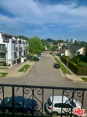 a view of a patio with wooden floor