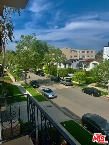 a view of a street with sitting area