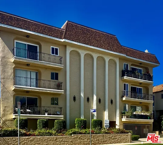 a front view of a building with street view