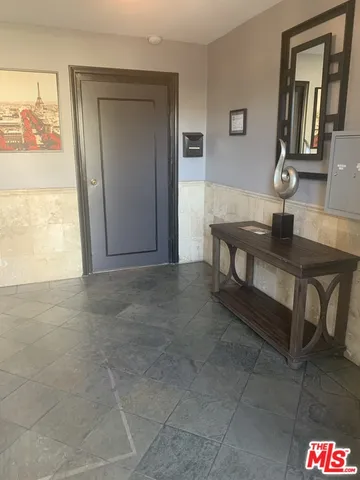 a view of hall way with furniture