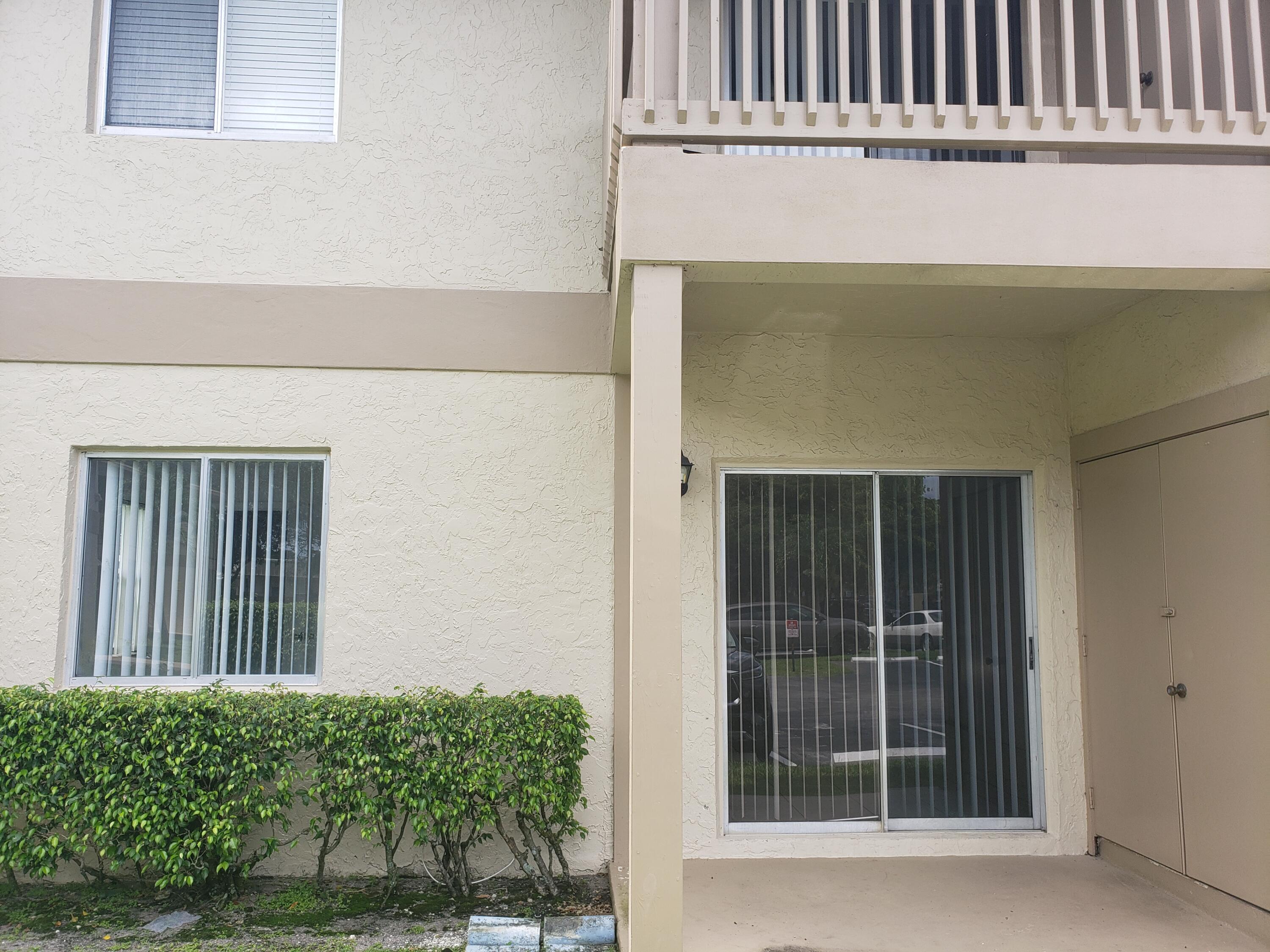 1854 Abbey Road, Unit 101 West Palm Beach, FL 33415 - Photo 1 of 16 Front Patio