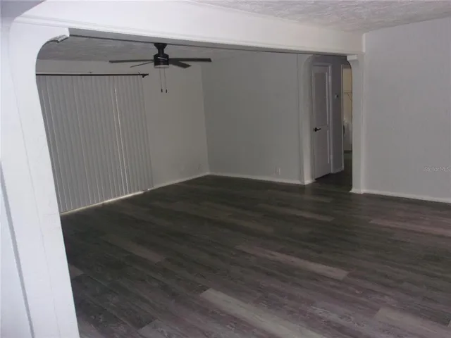 an empty room with wooden floor