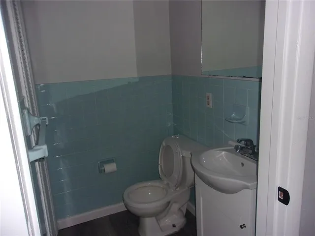 a bathroom with a sink and toilet