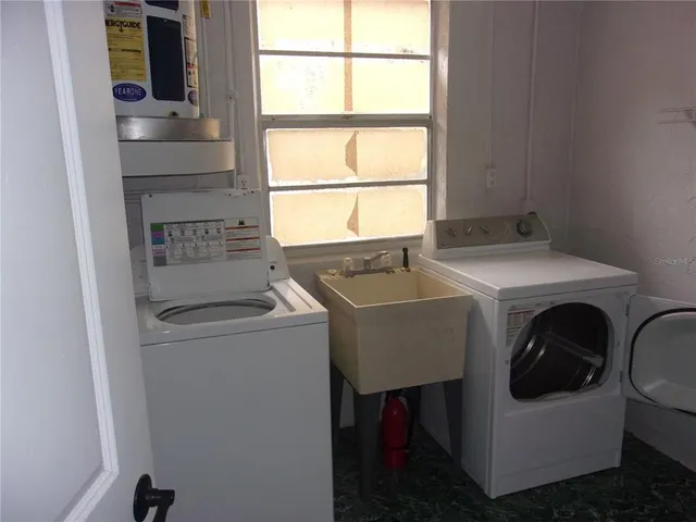 a utility room with dryer and washer