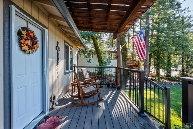 a view of balcony with furniture and wooden deck
