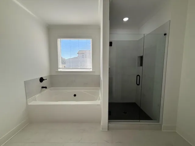 a bathroom with a sink a toilet a shower and a mirror
