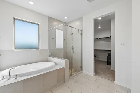 a bathroom with a bathtub and a toilet