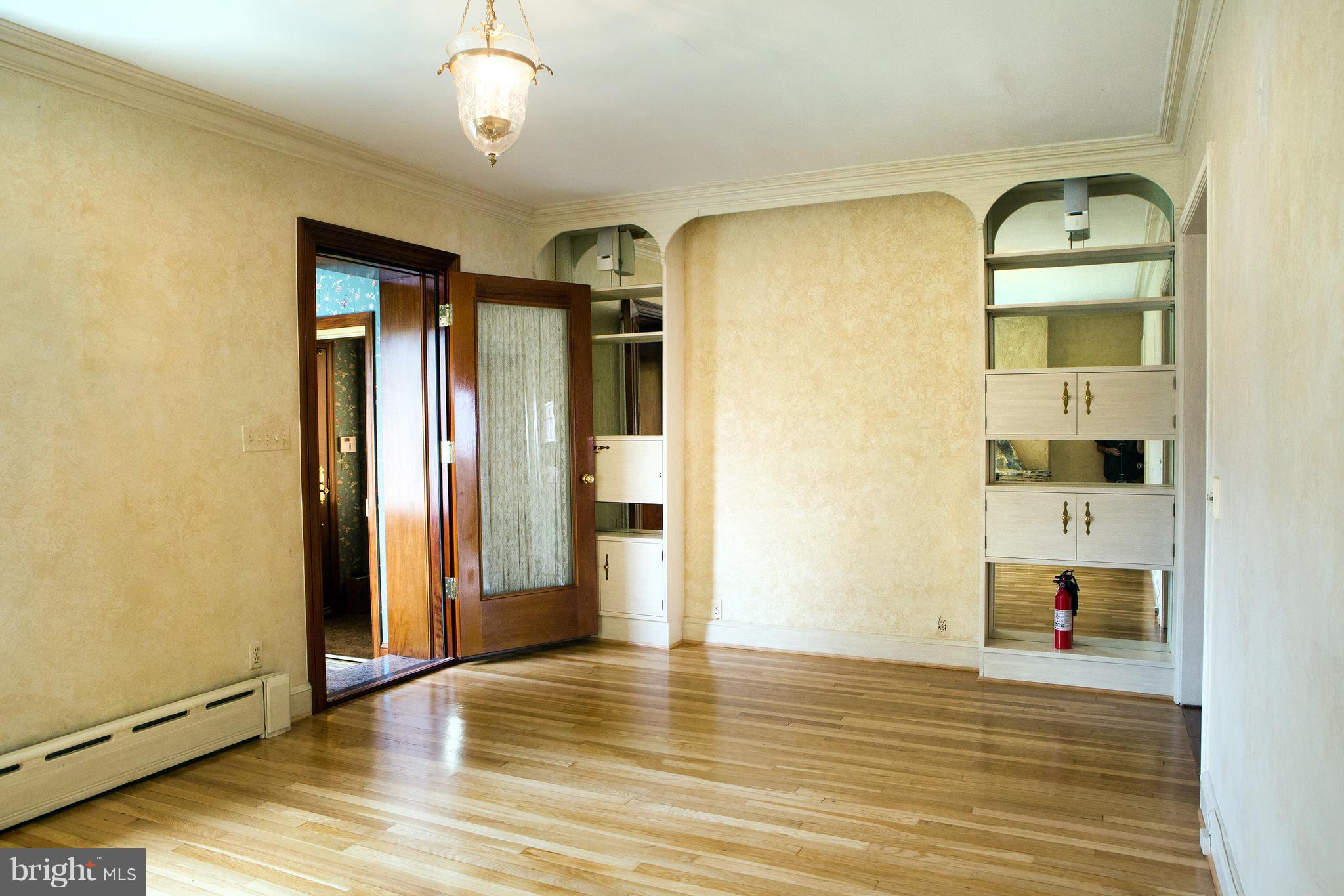 3521 R Street Northwest Washington, DC 20007 - Photo 3 of 30 a view of empty room with wooden floor and fan