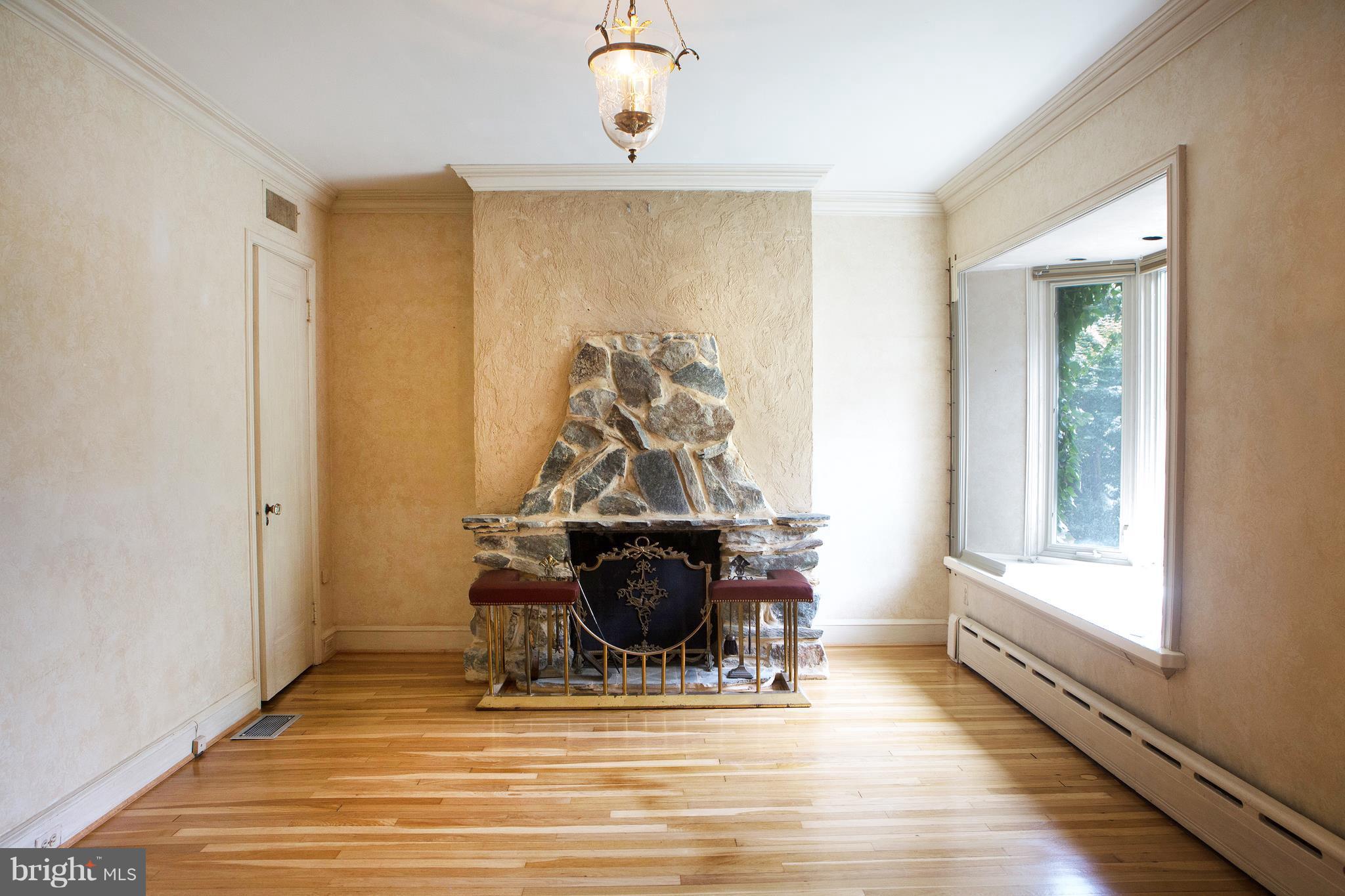 3521 R Street Northwest Washington, DC 20007 - Photo 4 of 30 a view of a workspace with wooden floor and windows