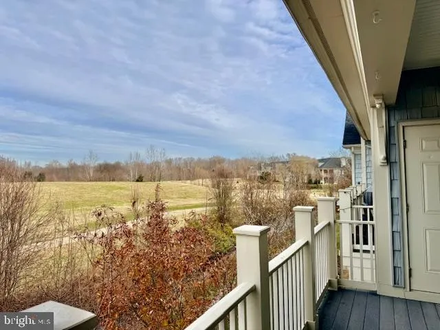 a view of a balcony with an ocean view