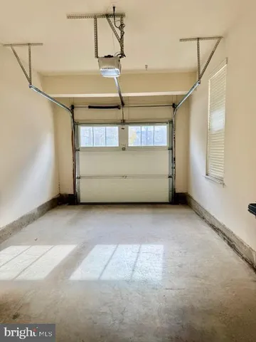 a kitchen with stainless steel appliances kitchen island granite countertop a sink and cabinets