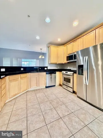 a view of a kitchen with a dishwasher and cabinets
