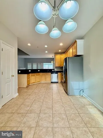 a view of an empty room with a fireplace