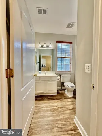a bathroom with a double vanity sink a mirror and a shower