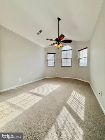 a view of empty room with windows