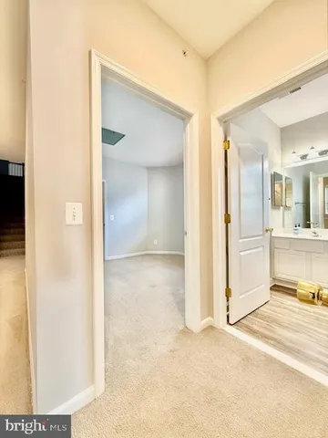 a view of a bathroom with mirror