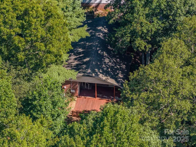a view of a house with a tree