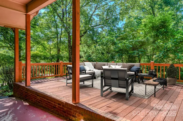 a view of a patio with a table chairs and backyard