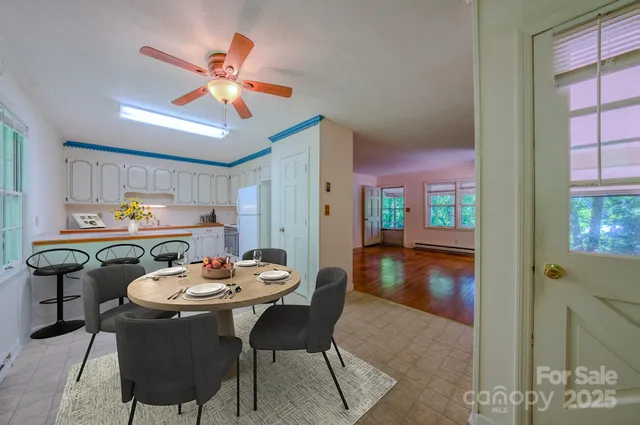 a dining room with furniture and window