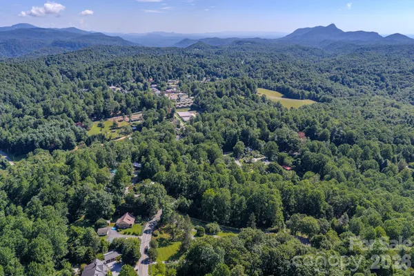 an aerial view of a lush green valley