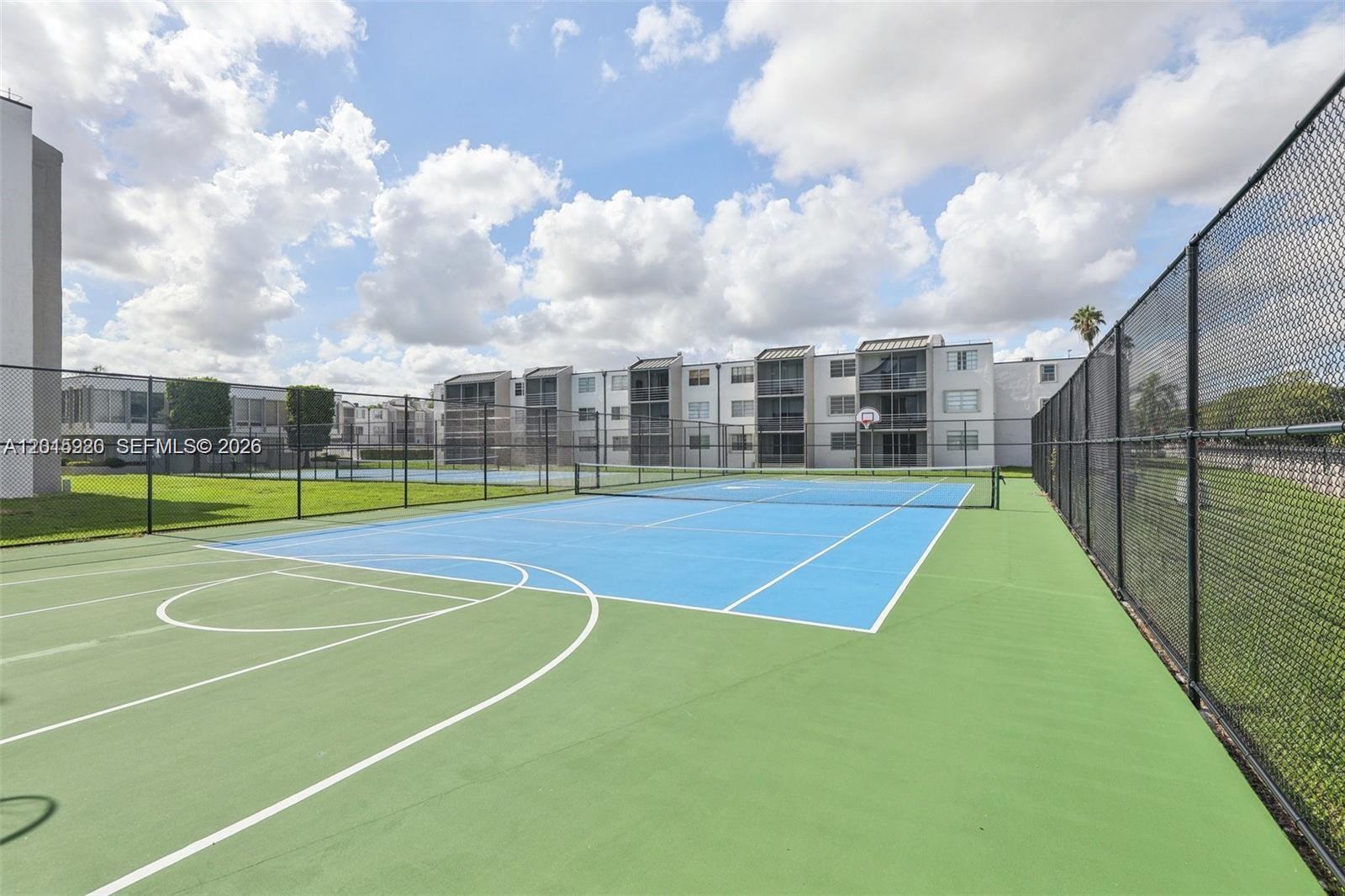 14170 Southwest 84th Street, Unit 404F Miami, FL 33183 - Photo 16 of 18 a view of a tennis court