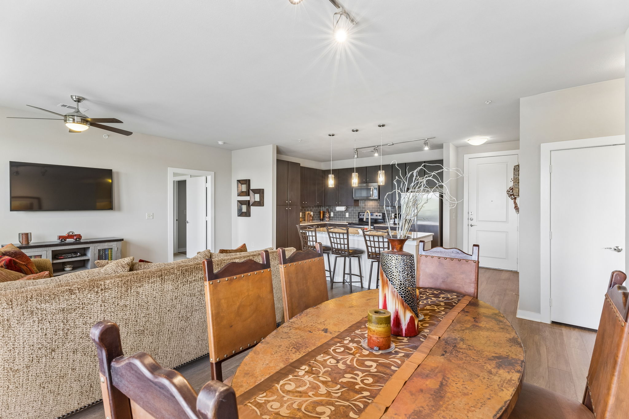 1900 Barton Springs Road, Unit 5032 Austin, TX 78704 - Photo 27 of 40 Open-concept living space with wood-finish flooring, a contemporary ceiling fan, and recessed lighting