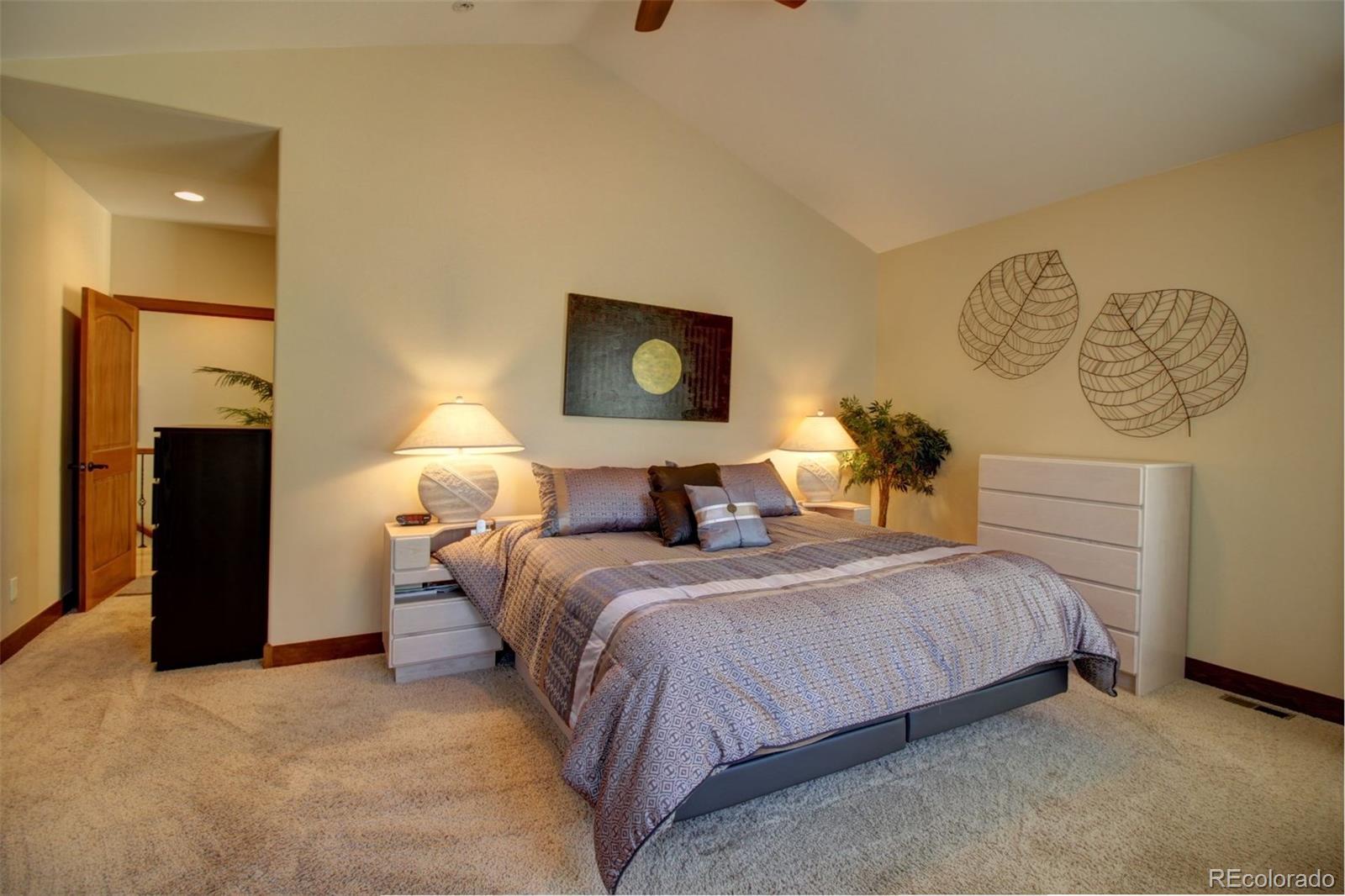 3095 South Piney Ridge Road Evergreen, CO 80439 - Photo 14 of 30 a bedroom with bed and window