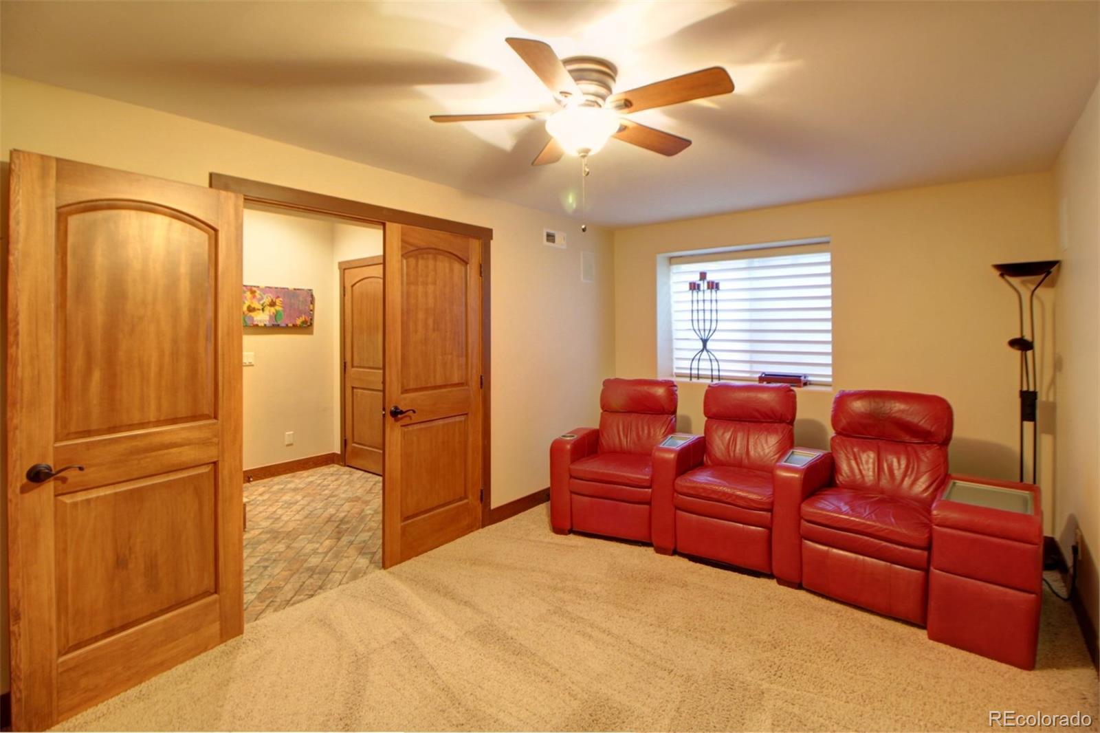 3095 South Piney Ridge Road Evergreen, CO 80439 - Photo 16 of 30 a bedroom with a bed dresser and a window