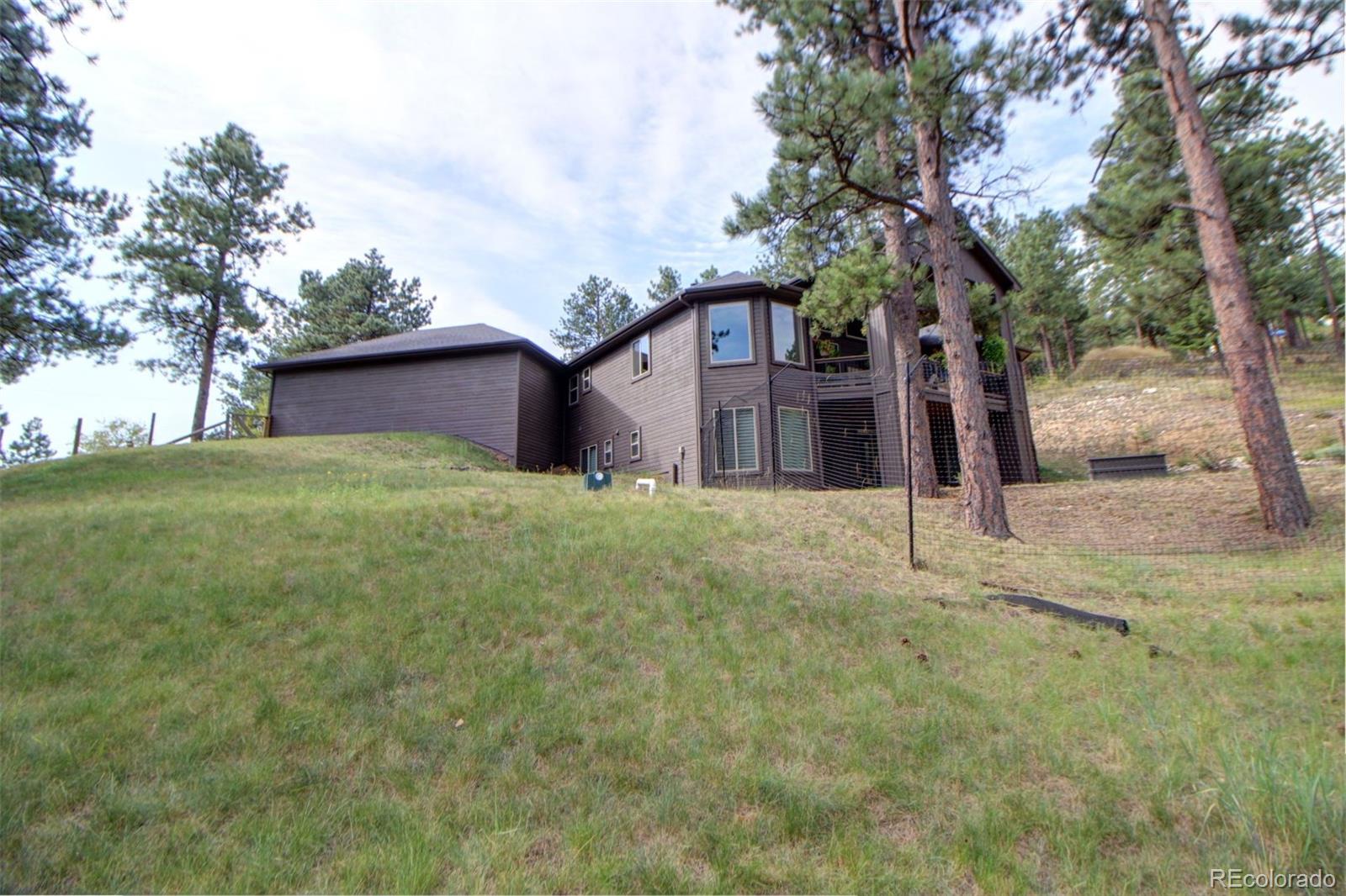 3095 South Piney Ridge Road Evergreen, CO 80439 - Photo 26 of 30 a house view with a garden space