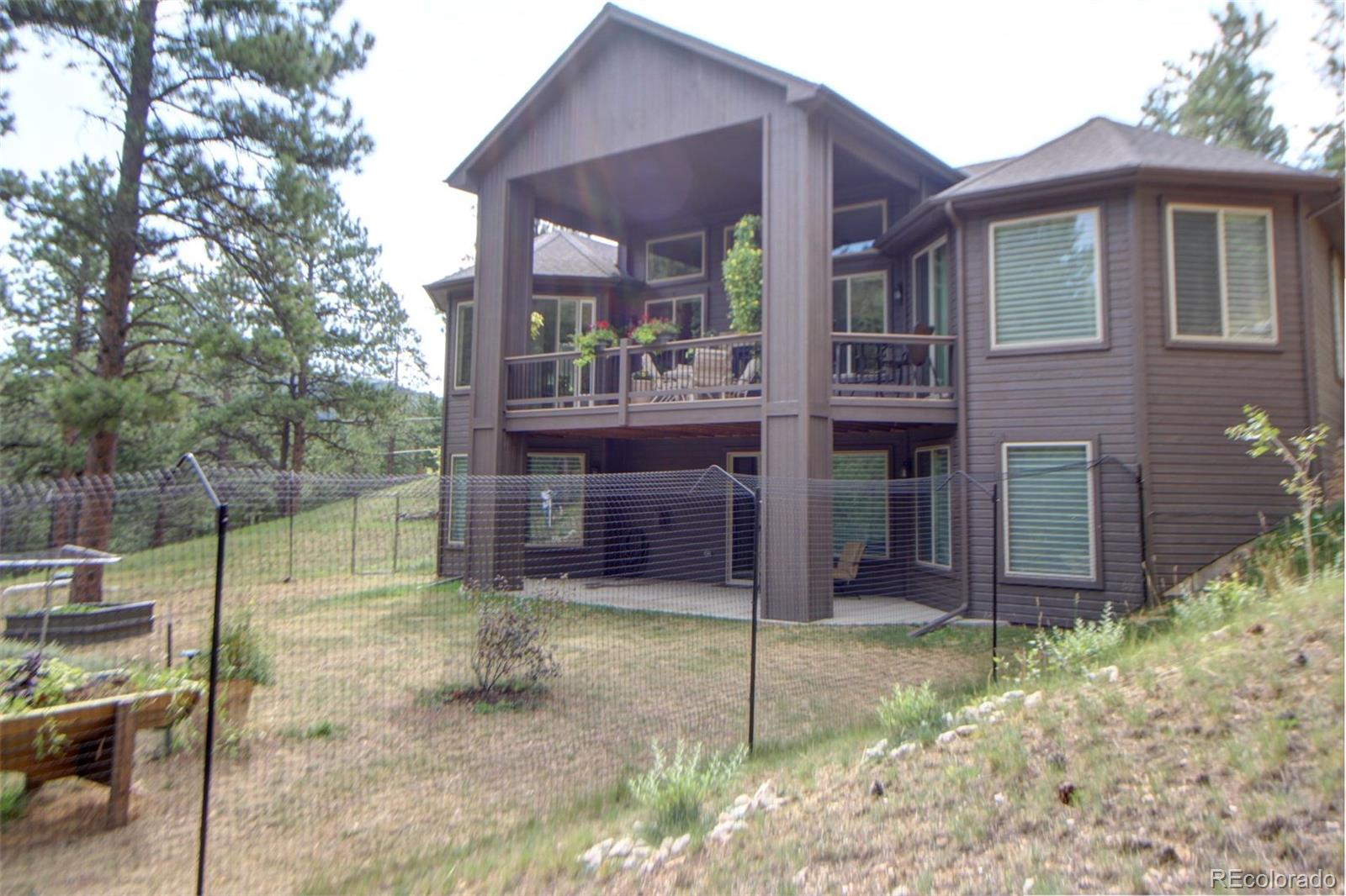 3095 South Piney Ridge Road Evergreen, CO 80439 - Photo 30 of 30 a view of house with yard